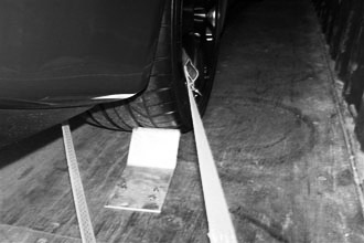 Chocked wheels and single point lashing is a minimum standard that should be accepted